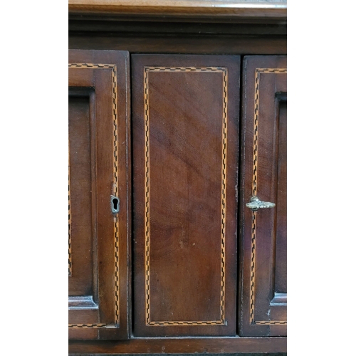 156 - A MAHOGANY INLAID TWO DOOR SIDE BOARD / BUFFET TABLE, to the front are a pair of cabinets; each with... 