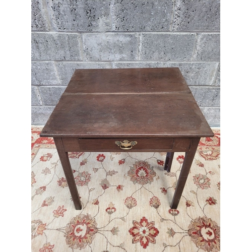 164 - A FOLD OVER TEA TABLE, with gate leg to back, a single frieze drawer with brass swan neck handle and... 