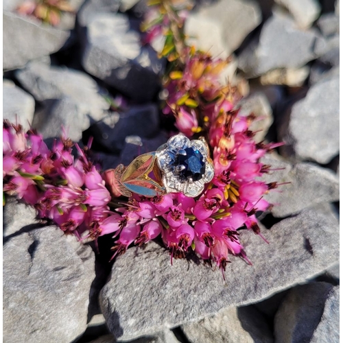 17 - A BEAUTIFUL VINTAGE 18CT YELLOW GOLD SAPPHIRE & DIAMOND DRESS RING, with a central oval shaped dark ... 