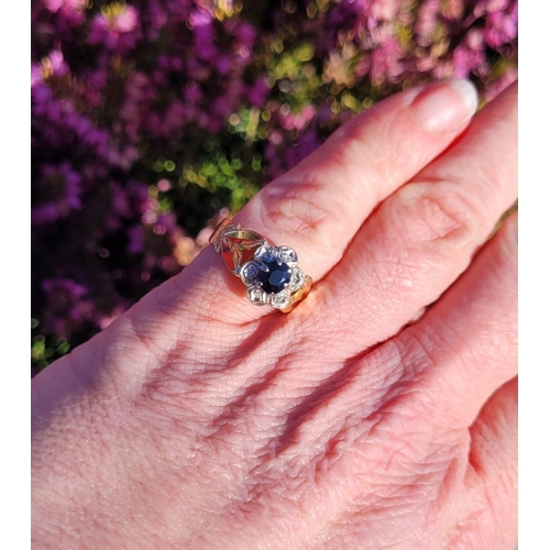 17 - A BEAUTIFUL VINTAGE 18CT YELLOW GOLD SAPPHIRE & DIAMOND DRESS RING, with a central oval shaped dark ... 