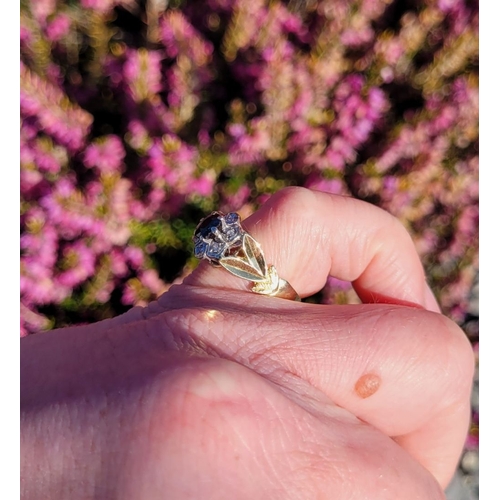 17 - A BEAUTIFUL VINTAGE 18CT YELLOW GOLD SAPPHIRE & DIAMOND DRESS RING, with a central oval shaped dark ... 