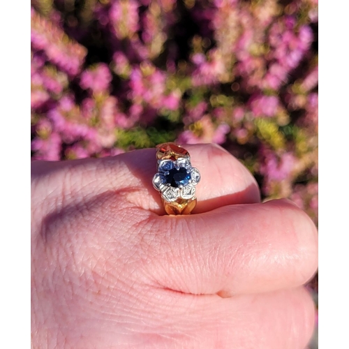 17 - A BEAUTIFUL VINTAGE 18CT YELLOW GOLD SAPPHIRE & DIAMOND DRESS RING, with a central oval shaped dark ... 