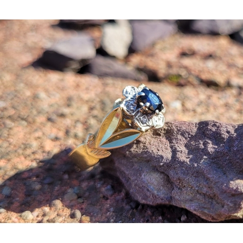 17 - A BEAUTIFUL VINTAGE 18CT YELLOW GOLD SAPPHIRE & DIAMOND DRESS RING, with a central oval shaped dark ... 