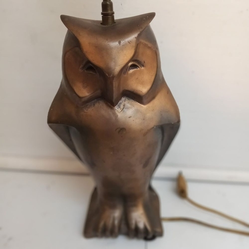 179 - A MID-20TH CENTURY TABLE LAMP IN THE FORM OF A SEATED OWL, 44cm tall.