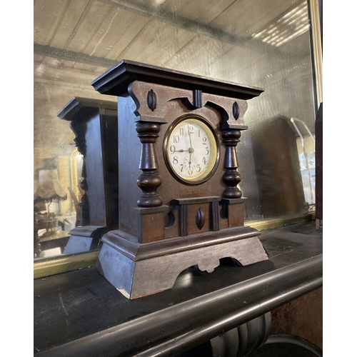 195 - A FINE MAHOGANY MANTLE CLOCK, the dial with subsidiary second dial, within highly carved mahogany fr... 