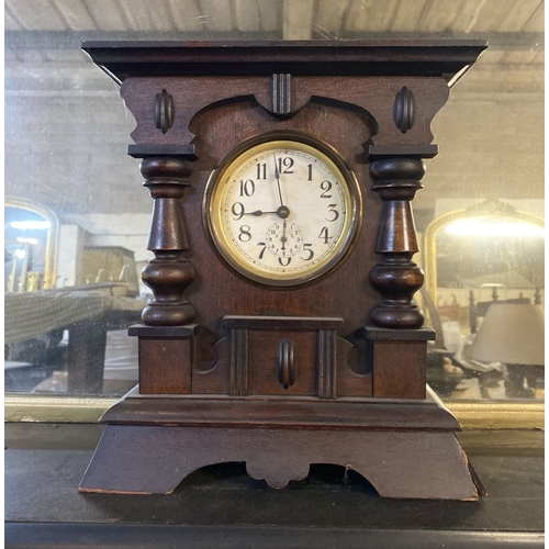 195 - A FINE MAHOGANY MANTLE CLOCK, the dial with subsidiary second dial, within highly carved mahogany fr... 