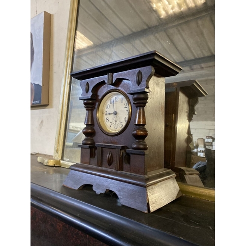 195 - A FINE MAHOGANY MANTLE CLOCK, the dial with subsidiary second dial, within highly carved mahogany fr... 