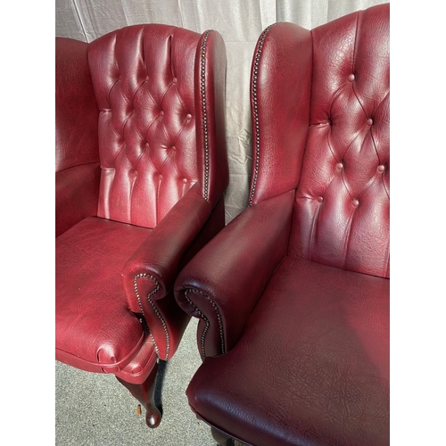 2 - A GOOD PAIR OF LEATHER CHESTERFIELD WINGBACK ARMCHAIRS, with deep red leather button back upholstery... 