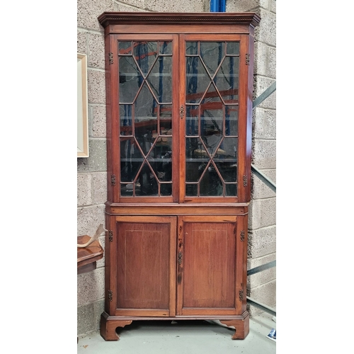 208 - A TALL GEORGIAN ASTRAGAL GLAZED CORNER BOOKCASE/DISPLAY CABINET, The top with dentil moulding over t... 