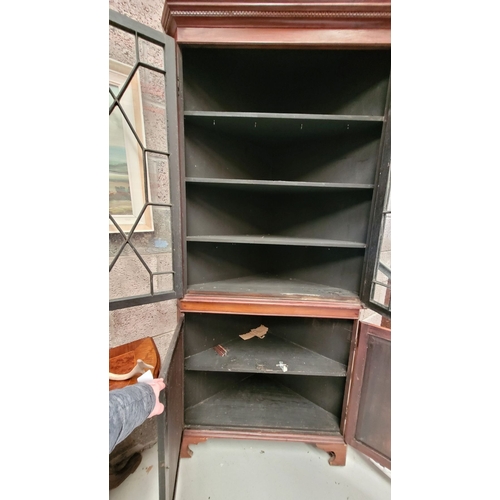 208 - A TALL GEORGIAN ASTRAGAL GLAZED CORNER BOOKCASE/DISPLAY CABINET, The top with dentil moulding over t... 