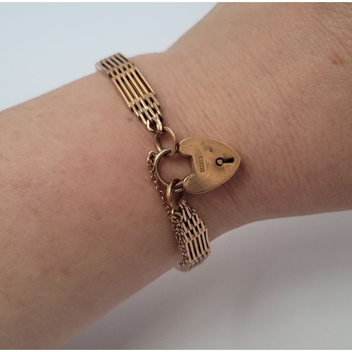 21 - A 9CT GOLD ‘GATE’ LINK BRACELET WITH HEART SHAPED LOCK, a lovely design, weighs: 16.7grams. Includes... 