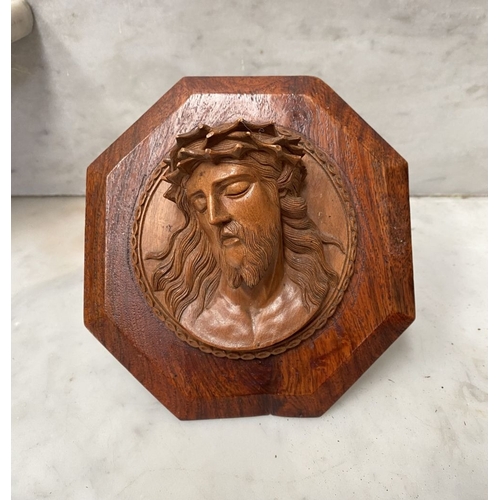 216 - A VINTAGE CARVED FRUITWOOD RELIGIOUS RELIEF ALONG WITH A HARDWOOD MOTHER OF PEARL CRUCIFIX, with car... 