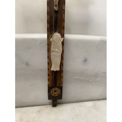 216 - A VINTAGE CARVED FRUITWOOD RELIGIOUS RELIEF ALONG WITH A HARDWOOD MOTHER OF PEARL CRUCIFIX, with car... 