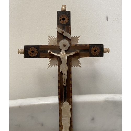 216 - A VINTAGE CARVED FRUITWOOD RELIGIOUS RELIEF ALONG WITH A HARDWOOD MOTHER OF PEARL CRUCIFIX, with car... 