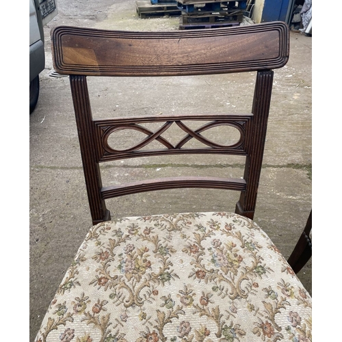 219 - A PAIR OF 19TH CENTURY MAHOGANY DINING CHAIRS, each with reeded border to top rail above carved spla... 