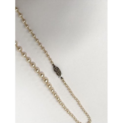 230 - A ‘LOTUS DE LUXE’ GRADUATED SIMULATED PEARL NECKLACE WITH SILVER CLASP, simulated pearl necklace in ... 