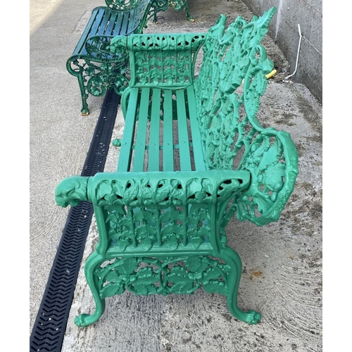 232 - A VERY GOOD QUALITY PAINTED CAST IRON GARDEN BENCH, decorated with scrolling oak leaf decoration to ... 