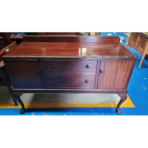 243 - AN EARLY 20TH CENTURY MAHOGANY BUFFET / SIDEBOARD, possibly O’Connell’s of Cork, with a raised back ... 