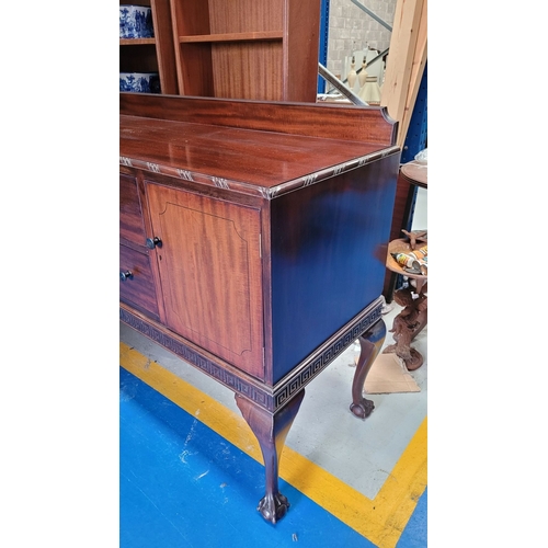 243 - AN EARLY 20TH CENTURY MAHOGANY BUFFET / SIDEBOARD, possibly O’Connell’s of Cork, with a raised back ... 