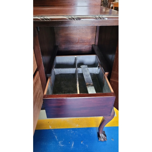 243 - AN EARLY 20TH CENTURY MAHOGANY BUFFET / SIDEBOARD, possibly O’Connell’s of Cork, with a raised back ... 