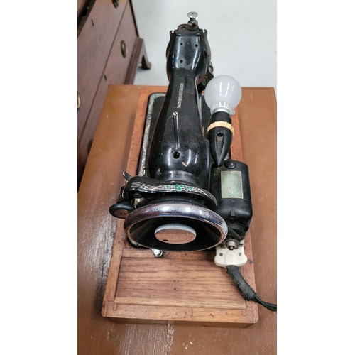 247 - AN VINTAGE IRISH LUCIA PRECISION SEWING MACHINE – MOTOR BY HILLMAN ELECTRIC MOTORS LTD, sitting on a... 