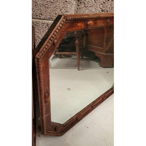 248 - AN ANTIQUE CARVED OAK FRAMED BEVELLED MIRROR, with bead trim detail to the frame, octagonal in shape... 