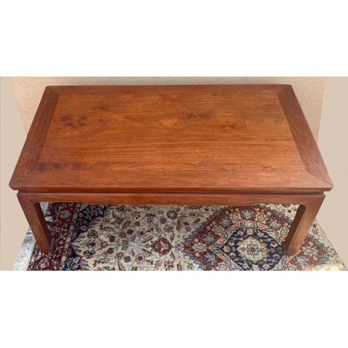 251 - AN ASIAN STYLE HARDWOOD LOW RISE COFFEE TABLE, with shaped legs. In over all good condition; surface... 