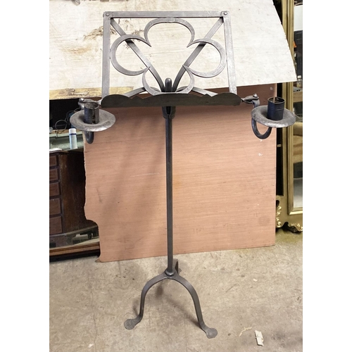 256 - AN EXCELLENT WROUGHT IRON LECTERN, forge worked with two candlesticks, on support atop tripod base. ... 