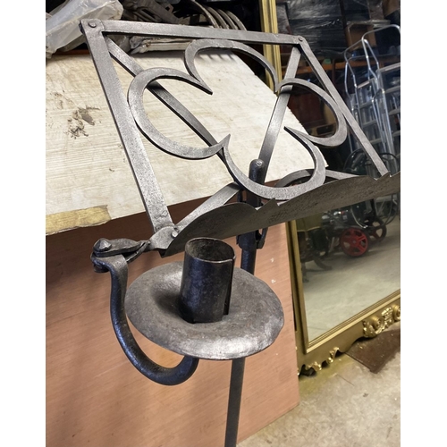 256 - AN EXCELLENT WROUGHT IRON LECTERN, forge worked with two candlesticks, on support atop tripod base. ... 