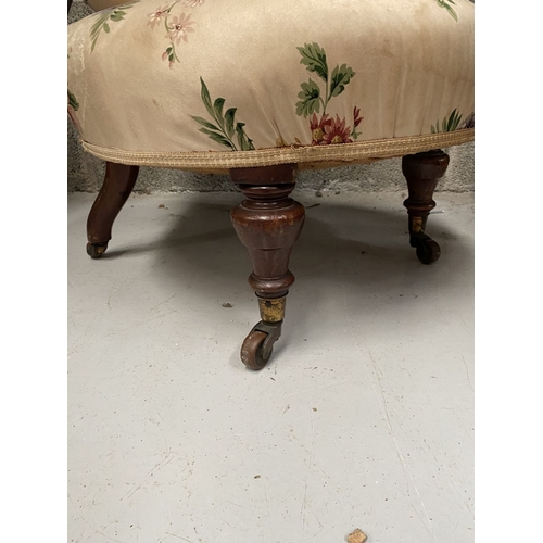 277 - A FINE FLORAL UPHOLSTERED NURSING CHAIR, with floral upholstered back rest and seat, resting on turn... 