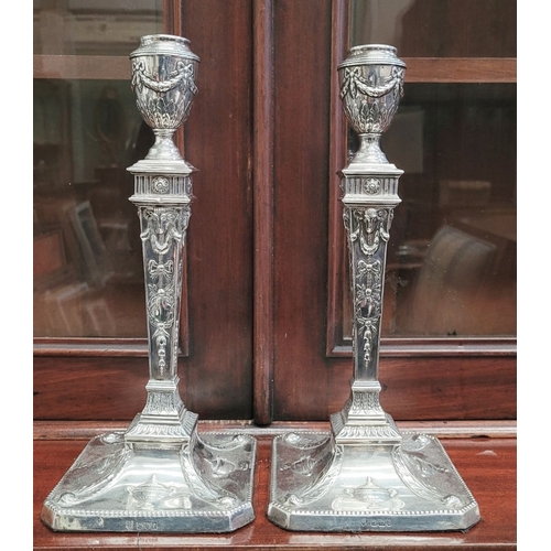 28 - AN IMPRESSIVE PAIR OF EDWARDIAN SILVER CANDLEABRA, both with detachable three heads, two held up wit... 