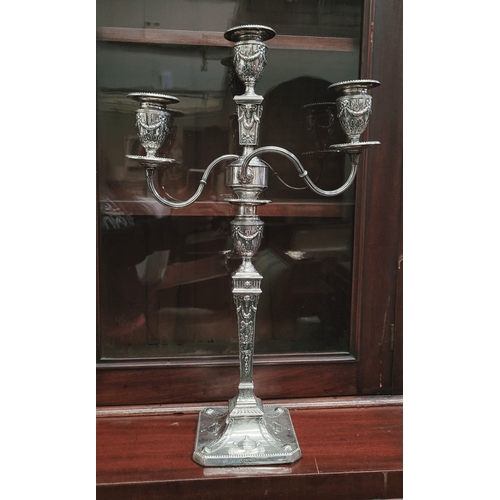 28 - AN IMPRESSIVE PAIR OF EDWARDIAN SILVER CANDLEABRA, both with detachable three heads, two held up wit... 