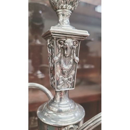 28 - AN IMPRESSIVE PAIR OF EDWARDIAN SILVER CANDLEABRA, both with detachable three heads, two held up wit... 