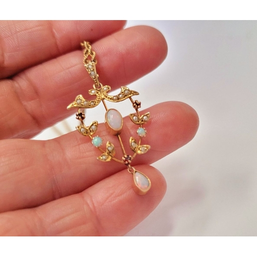 29 - A BEAUTIFUL & DELICATE 9CT YELLOW GOLD OPAL, GARNET & SEED PEARL PENDANT ON A ROPE CHAIN, the pendan... 