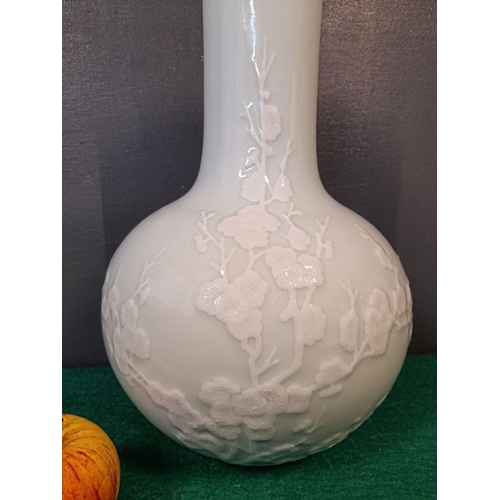 293 - A LARGE 20TH CENTURY CHINESE VASE, with raised floral blossom design to the body and a tall narrow n... 