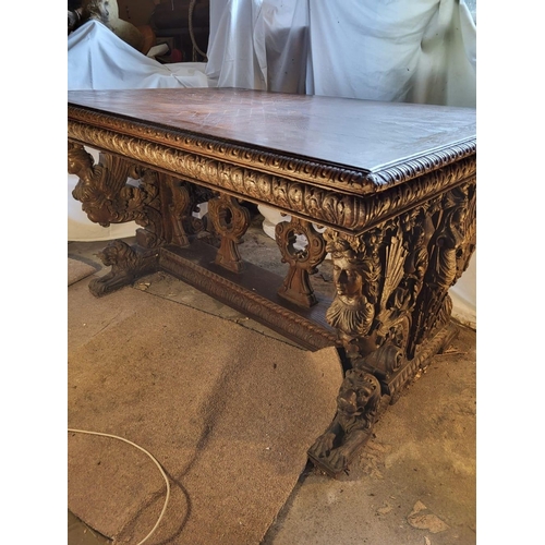 295 - AN EXCELLENT RENAISSANCE REVIVAL CARVED LIBRARY TABLE, with crossbanding to top, the edges with moul... 