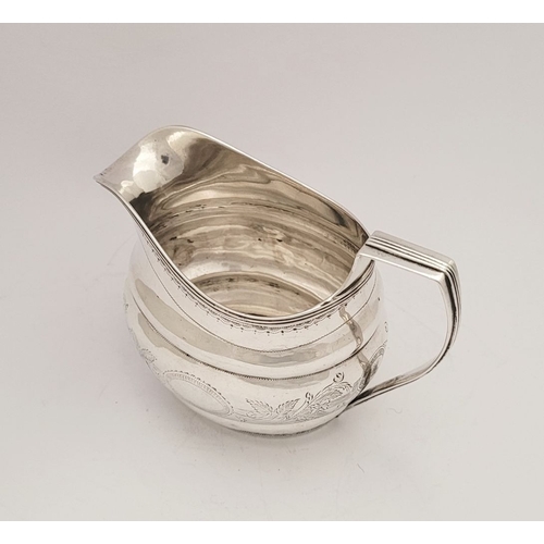 31 - A VERY FINE & RARE CORK IRISH SILVER CREAM JUG, circa 1800, impressed ‘STERLING’ mark to the base, a... 