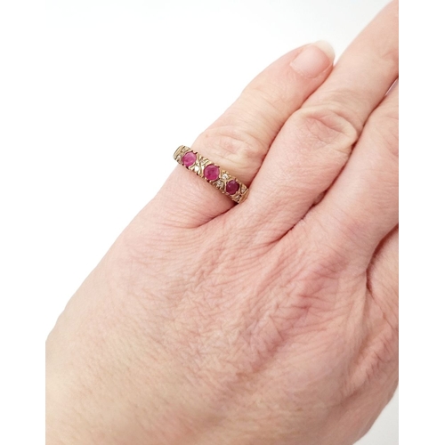 34 - A VINTAGE 9CT YELLOW GOLD 11 STONE DIAMOND & RUBY RING, with raised setting, three round cut rubies ... 