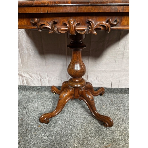 4 - A VICTORIAN ROSEWOOD CARD TABLE, with shaped top opening to green baize lined interior, above frieze... 