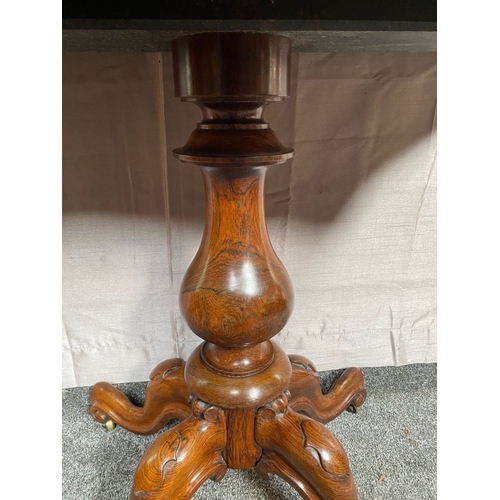 4 - A VICTORIAN ROSEWOOD CARD TABLE, with shaped top opening to green baize lined interior, above frieze... 