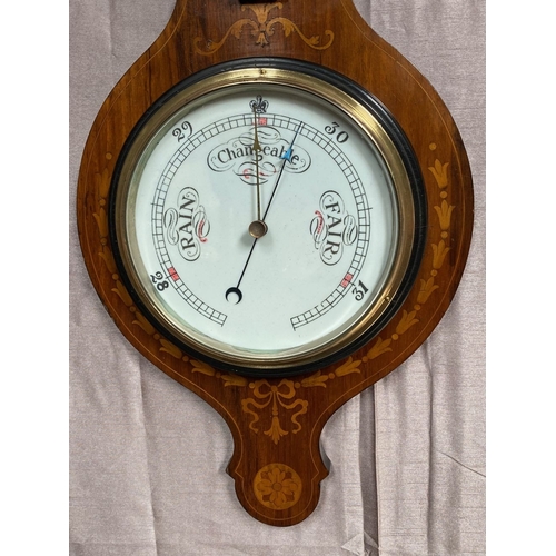 40 - A VERY GOOD ROSEWOOD INLAID BAROMETER THERMOMETER, the rosewood frame inlaid with bow and swag decor... 