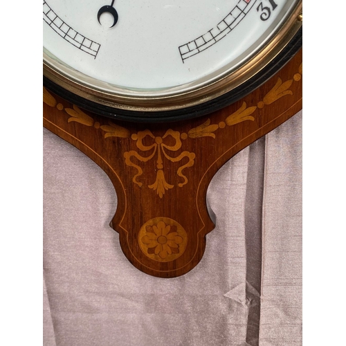 40 - A VERY GOOD ROSEWOOD INLAID BAROMETER THERMOMETER, the rosewood frame inlaid with bow and swag decor... 