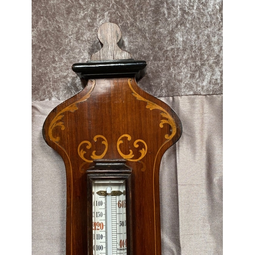 40 - A VERY GOOD ROSEWOOD INLAID BAROMETER THERMOMETER, the rosewood frame inlaid with bow and swag decor... 