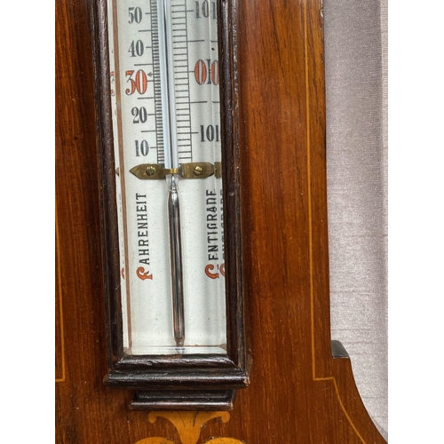 40 - A VERY GOOD ROSEWOOD INLAID BAROMETER THERMOMETER, the rosewood frame inlaid with bow and swag decor... 