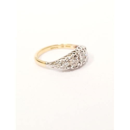 47 - AN 18CT YELLOW GOLD FIVE STONE DIAMOND RING, the graduated stones in a raised wave setting. Estimate... 