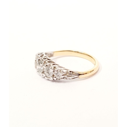 47 - AN 18CT YELLOW GOLD FIVE STONE DIAMOND RING, the graduated stones in a raised wave setting. Estimate... 