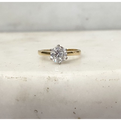 5 - A BEAUTIFUL 18CT YELLOW GOLD DIAMOND SOLITAIRE RING, with central round brilliant cut diamond set in... 