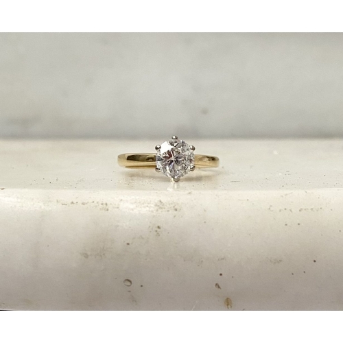 5 - A BEAUTIFUL 18CT YELLOW GOLD DIAMOND SOLITAIRE RING, with central round brilliant cut diamond set in... 