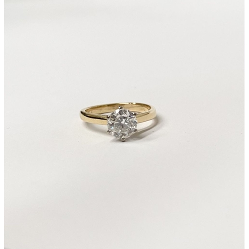 5 - A BEAUTIFUL 18CT YELLOW GOLD DIAMOND SOLITAIRE RING, with central round brilliant cut diamond set in... 