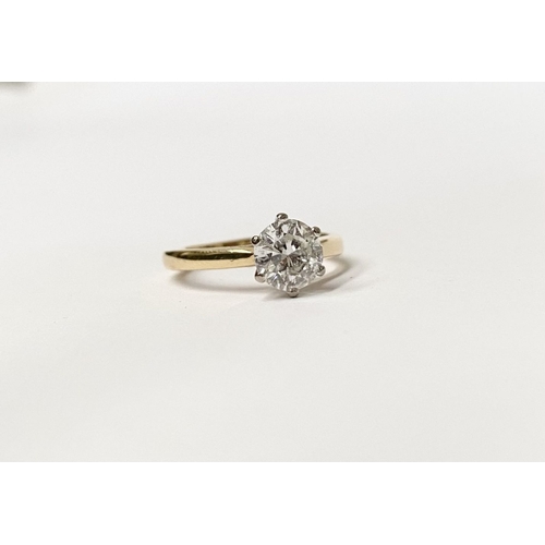 5 - A BEAUTIFUL 18CT YELLOW GOLD DIAMOND SOLITAIRE RING, with central round brilliant cut diamond set in... 